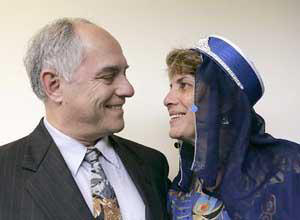 Joe Pessah and his wife, Remy Pessah, attend a gathering at Jewish Community High School in San Francisco.